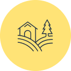 A yellow circle with a house and tree in it