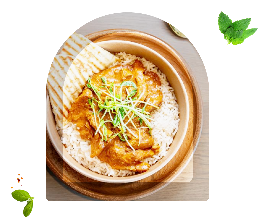 A bowl of rice and some vegetables on top.